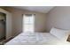 Cozy bedroom with a window, plush bedding, a neutral color palette, and a closet for storage at 11596 W Sierra Dawn Blvd # 33, Surprise, AZ 85378