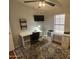 Functional bedroom with a built-in desk, ceiling fan, and stylish rug, offering a comfortable workspace at 11596 W Sierra Dawn Blvd # 33, Surprise, AZ 85378