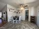 Dining area featuring a round table with white chairs, decorative wall art, and an adjacent walk in closet at 11596 W Sierra Dawn Blvd # 33, Surprise, AZ 85378