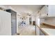 Kitchen area with an eating area that has lots of natural lighting, tile flooring, and white cabinets at 11596 W Sierra Dawn Blvd # 33, Surprise, AZ 85378
