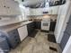 Traditional-style kitchen offering white and gray cabinets, modern appliances, and stylish overhead decor at 11596 W Sierra Dawn Blvd # 33, Surprise, AZ 85378