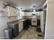 Well-lit kitchen featuring two-tone cabinets, modern appliances, and tile flooring at 11596 W Sierra Dawn Blvd # 33, Surprise, AZ 85378