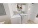 Laundry room featuring a newer washer and dryer with added storage space above at 11596 W Sierra Dawn Blvd # 33, Surprise, AZ 85378