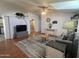 Spacious living room with hardwood floors, vaulted ceilings, and ample natural light at 11596 W Sierra Dawn Blvd # 33, Surprise, AZ 85378