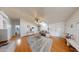 Bright living room with vaulted ceilings, skylights, wood floors, and a cozy seating area at 11596 W Sierra Dawn Blvd # 33, Surprise, AZ 85378