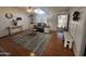 Bright living room with a vaulted ceiling, stylish decor, and wood-look floors at 11596 W Sierra Dawn Blvd # 33, Surprise, AZ 85378