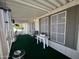 Relaxing covered porch with green carpet and outdoor furniture at 11596 W Sierra Dawn Blvd # 33, Surprise, AZ 85378