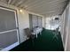 Relaxing covered porch with green carpet and outdoor furniture at 11596 W Sierra Dawn Blvd # 33, Surprise, AZ 85378