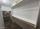 Spacious walk-in closet with built-in shelving and plenty of storage options at 11596 W Sierra Dawn Blvd # 33, Surprise, AZ 85378