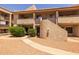 Charming condo complex featuring a terracotta tile roof and desert landscaping at 11666 N 28Th Dr # 295, Phoenix, AZ 85029
