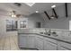 A large counter separates the kitchen and dining area in this open floor plan, with abundant lighting at 11666 N 28Th Dr # 295, Phoenix, AZ 85029