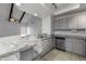 A kitchen is highlighted by granite counters, stainless appliances, and a view into a large living space at 11666 N 28Th Dr # 295, Phoenix, AZ 85029