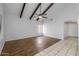 Open living space featuring hardwood floors, a fan, and natural lighting at 11666 N 28Th Dr # 295, Phoenix, AZ 85029