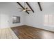 Bright and airy living space with tile and hardwood floors, and a white front door at 11666 N 28Th Dr # 295, Phoenix, AZ 85029