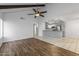 Open floor plan living space featuring hardwood floors and an adjacent kitchen at 11666 N 28Th Dr # 295, Phoenix, AZ 85029