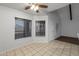 An open floor plan features a bright living room area with a large window and access to the entry door at 11666 N 28Th Dr # 295, Phoenix, AZ 85029