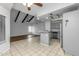 This combination room shows an open kitchen with an attached seating area and vaulted ceilings at 11666 N 28Th Dr # 295, Phoenix, AZ 85029
