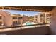 View of the community pool surrounded by well-maintained buildings at 11666 N 28Th Dr # 295, Phoenix, AZ 85029