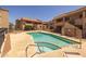 A shared community pool has crystal-clear blue water and plenty of space for everyone at 11666 N 28Th Dr # 295, Phoenix, AZ 85029