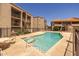 Community pool with nearby lounge chairs surrounded by apartment buildings at 11666 N 28Th Dr # 295, Phoenix, AZ 85029