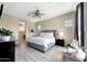 Comfortable bedroom with neutral colors, a ceiling fan, and plenty of natural light at 11807 W Parkway Ln, Avondale, AZ 85323
