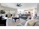 Bright living room showcases open floor plan, connecting seamlessly to the kitchen and dining area at 11807 W Parkway Ln, Avondale, AZ 85323