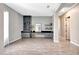 Open-concept living area showcasing stylish built-in shelving and cabinets and neutral paint at 11807 W Parkway Ln, Avondale, AZ 85323