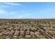 Expansive aerial view showcases a meticulously planned community surrounded by verdant landscapes and mountain vistas at 1281 E Frances Ln, Gilbert, AZ 85295