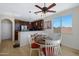 Cozy breakfast nook featuring a ceiling fan, breakfast bar and natural light at 1281 E Frances Ln, Gilbert, AZ 85295