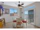 Cozy dining area featuring a ceiling fan, a view of the outdoors and seating for four at 1281 E Frances Ln, Gilbert, AZ 85295