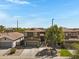 Two-story home with an attached garage and desert landscaping boasts charming curb appeal under a clear blue sky at 1281 E Frances Ln, Gilbert, AZ 85295