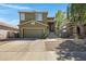 Charming two-story home with a two car garage and a welcoming elevated front entryway at 1281 E Frances Ln, Gilbert, AZ 85295
