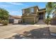 Charming two-story home with a two-car garage, an elevated front entryway, and low maintenance landscaping at 1281 E Frances Ln, Gilbert, AZ 85295