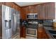 Close-up of the kitchen featuring stainless steel appliances and sleek dark countertops at 1281 E Frances Ln, Gilbert, AZ 85295