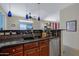 View of the kitchen sink and counter area, with pendant lights and stainless steel dishwasher at 1281 E Frances Ln, Gilbert, AZ 85295
