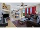 Comfortable living room with hardwood floors, fireplace, and open floor plan at 1281 E Frances Ln, Gilbert, AZ 85295