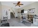 Bright home office with a standing desk, dual monitors, and plenty of natural light at 1281 E Frances Ln, Gilbert, AZ 85295