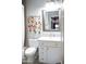 Charming bathroom featuring flower decorations, a vanity with ample storage and stylish decor at 13686 N 151St Dr, Surprise, AZ 85379