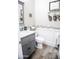 Charming half bathroom with stylish tile accents and a modern vanity at 13686 N 151St Dr, Surprise, AZ 85379