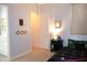 Cozy bedroom with modern decor, a comfortable bed, and a convenient side table at 13686 N 151St Dr, Surprise, AZ 85379
