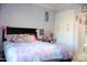 Comfortable bedroom featuring built-in closets, soft lighting, and whimsical decorations at 13686 N 151St Dr, Surprise, AZ 85379