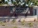 The community entrance sign adds distinction to the neighborhood, set against a backdrop of lush landscaping and greenery at 13686 N 151St Dr, Surprise, AZ 85379