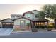 Charming two-story home with a well-maintained lawn and a welcoming front porch at 13686 N 151St Dr, Surprise, AZ 85379