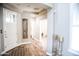 Inviting foyer with neutral paint, wood-look tile, and great ceiling detail at 13686 N 151St Dr, Surprise, AZ 85379
