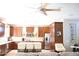 Spacious kitchen with wood cabinets, stainless steel appliances, an island, and pendant lighting at 13686 N 151St Dr, Surprise, AZ 85379