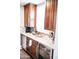 Kitchenette with wine refrigerator, mini-fridge, granite countertop, and dark wood cabinets at 13686 N 151St Dr, Surprise, AZ 85379
