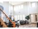 Bright and airy living room featuring high ceilings, large windows, and modern finishes at 13686 N 151St Dr, Surprise, AZ 85379