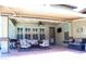 Relaxing covered patio with comfortable seating, outdoor kitchen, and charming decorative touches at 13686 N 151St Dr, Surprise, AZ 85379