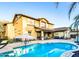 Inviting backyard pool with umbrella and outdoor seating perfect for entertaining guests at 13686 N 151St Dr, Surprise, AZ 85379