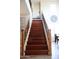Grand staircase featuring wooden steps, elegant iron railings, and natural light, adding character to the home at 13686 N 151St Dr, Surprise, AZ 85379